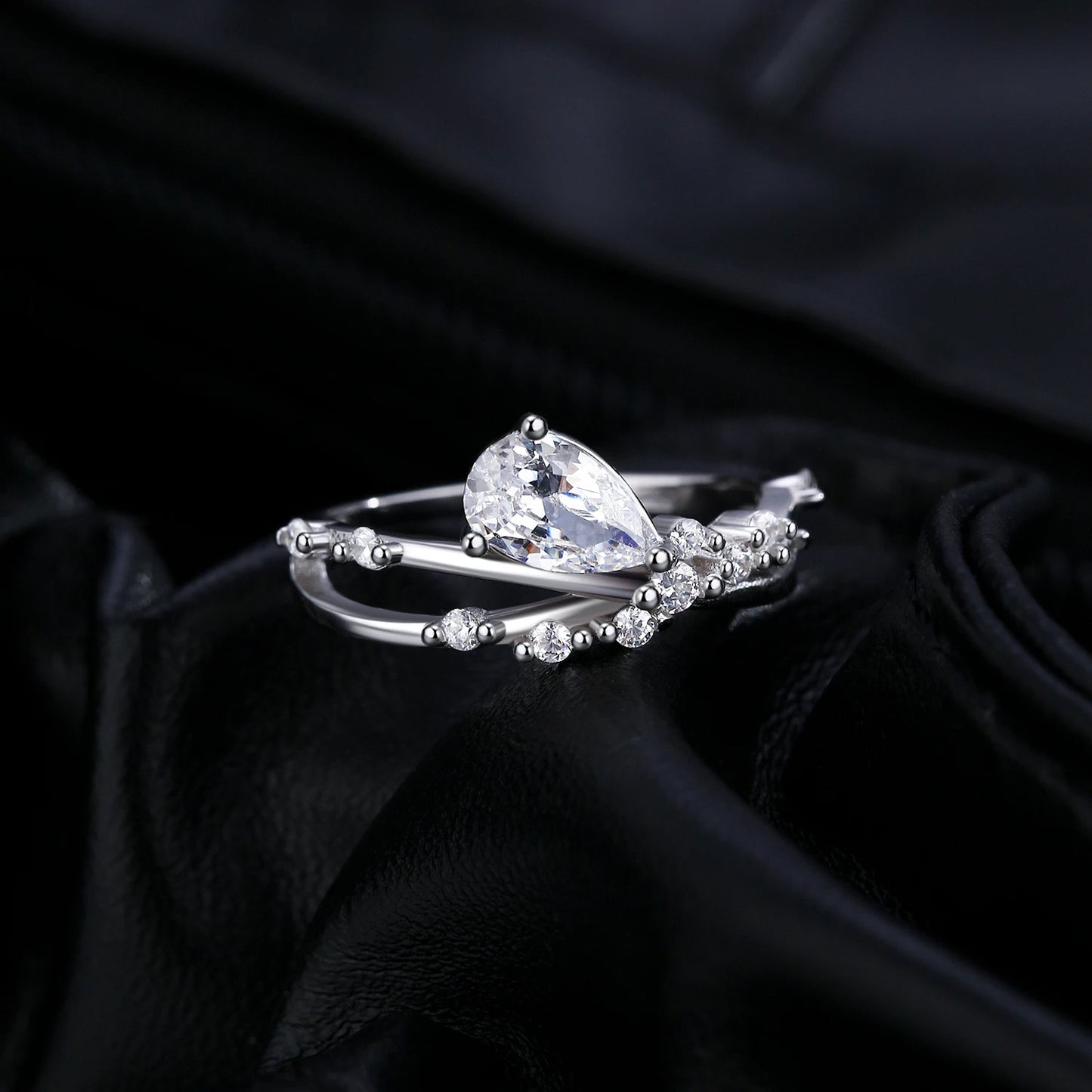 Sterling Silver Entangled Lines Water Drop CZ Ring